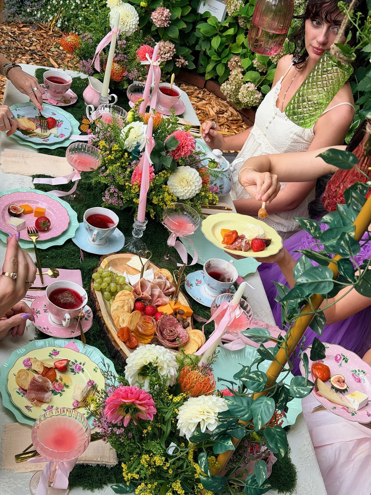 Guests enjoying tea and the Grazefully Gathered cheese board